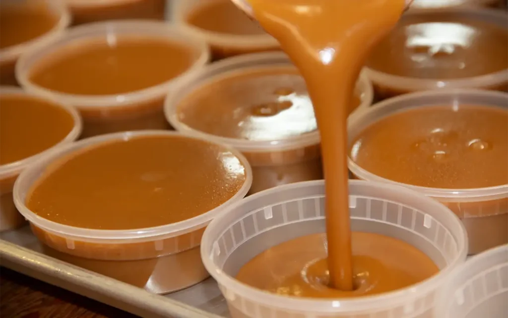 Apple Hill Caramel sauce poured into small cups.